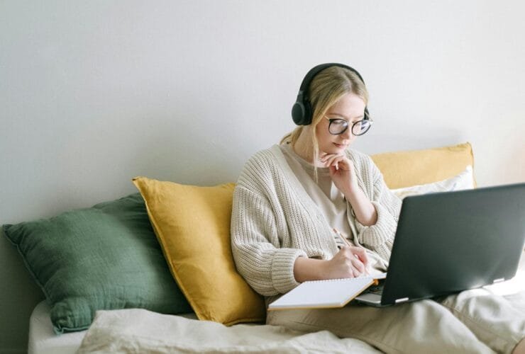 photo of woman taking notes